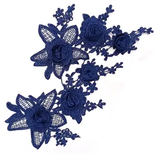 Detailed macro view of navy blue 3D floral water-soluble lace embroidery appliqué for DIY