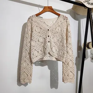 Bohemian style hollow out crochet cardigan with long sleeves and front buttons detail