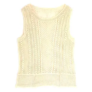 Close-up detail of a cream cotton hollow lace vest with intricate crochet embroidery patterns