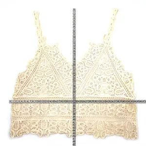 Off-white crochet lace vest measurement detail showing length and width dimensions.