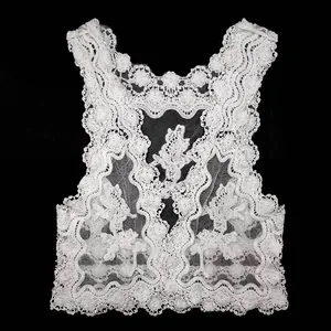 Detailed macro view of white cotton water-soluble lace vest for beach bikini cover-up