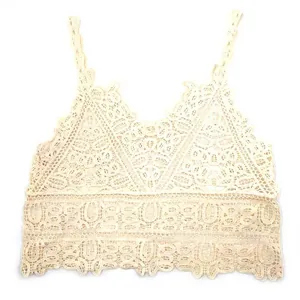 Intricate detailed view of a cream cotton water-soluble lace vest with hollow embroidery