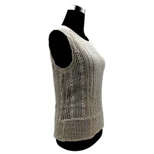 Detailed side profile of off-white crochet lace vest with textured knit patterns