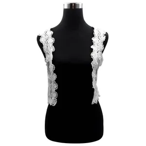 Detailed macro view of white cotton water-soluble lace vest with hollow embroidery