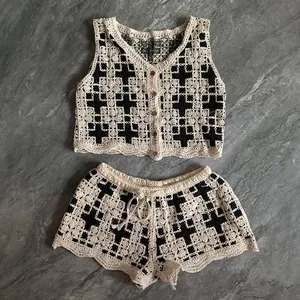 Detailed view of Bohemian hollow out crochet knit two-piece set with vest and shorts