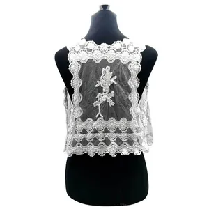 Back view of a white cotton water-soluble lace vest with delicate floral embroidery