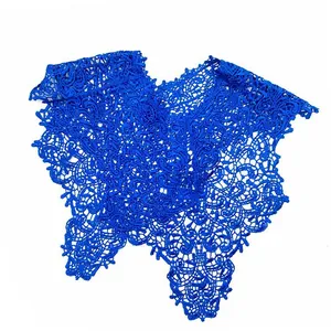 Detailed view of the royal blue hollowed-out lace embroidered decorative collar