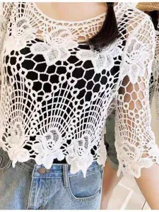 Elegant white hollow-out crochet lace top summer cover-up with intricate floral pattern details