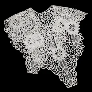 Detailed macro view of an intricate white lace hollow-out floral embroidered faux collar.