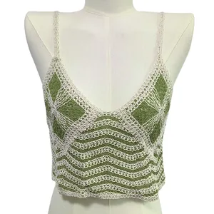 Close-up showing the intricate green and white crochet knit pattern on this summer camisole.