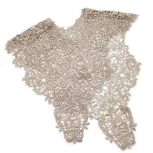 Detailed macro view of the intricate floral lace embroidery on a beige fake collar.
