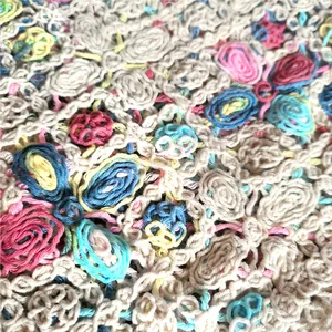 Detailed macro view of colorful bohemian hollow-out crochet knit floral patterns.