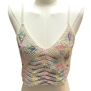 Macro view of a colorful handmade crochet knitted camisole featuring intricate details