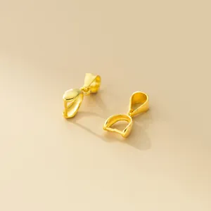 Close-up of golden 925 silver pinch bails for pendant DIY jewelry making