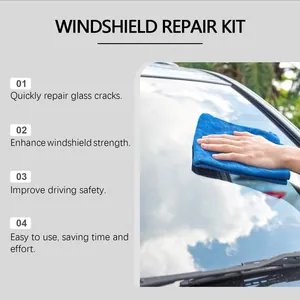 Close-up of using a blue microfiber cloth for professional windshield crack repair and cleaning