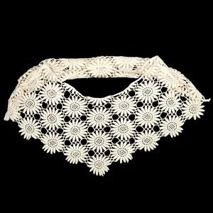 Detailed view of the delicate sunflower crochet lace pattern on the hollow-out shawl collar