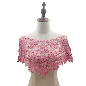 Detail view of stylish pink floral crochet lace shawl worn on a fashion mannequin torso
