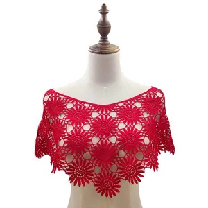 Close-up of red lace crochet shawl with sunflower patterns on a mannequin