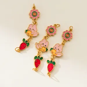 Close-up of cute 925 silver plated rabbit and carrot enamel charms for DIY jewelry