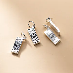 Detailed view of antique S925 sterling silver 100 dollar bill charms for DIY jewelry making