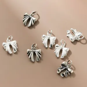 Collection of S925 silver vintage and bright bow-knot charms for DIY jewelry making.