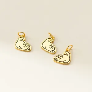 Close-up of three 925 sterling silver gold-plated cartoon cat charms for DIY bracelets.