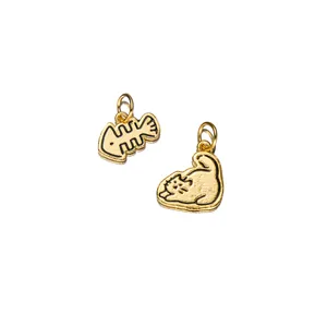 Detailed view of gold-plated 925 sterling silver cat and fish bone charms for DIY jewelry
