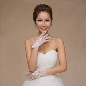 Close-up detail of sheer white bridal gloves featuring elegant floral lace embroidery