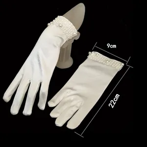 White short satin bridal gloves with pearl beaded cuffs showing size measurements