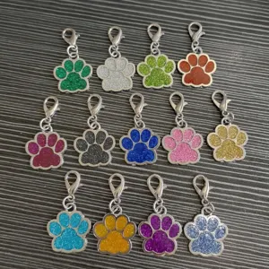 Detailed view of colorful glitter paw print pet charms with sturdy alloy lobster clasps