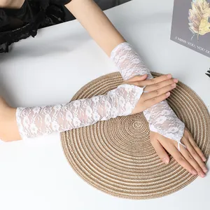 Elegant white lace fingerless bridal gloves with floral patterns for wedding dress