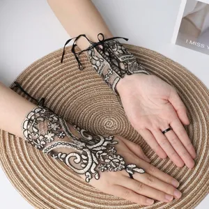 Short finger-hook black lace bridal gloves with intricate floral patterns for weddings