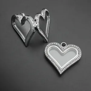 Detail view of heart-shaped silver locket with rhinestones and hinged glass cover