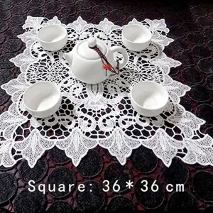Square white lace embroidered table mat 36x36cm shown with white ceramic tea set