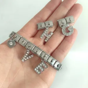 Close-up of stainless steel modular bracelet featuring sparkling letter charms