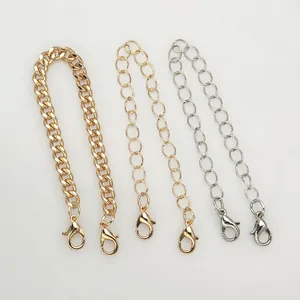 Detailed view of high-quality gold and silver metal chains with secure lobster clasps