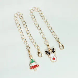 Detailed view of gold-plated alloy Christmas charms with reindeer and tree pendants for DIY.