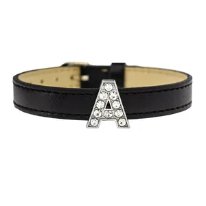 Macro detail of a 10mm rhinestone-encrusted letter A slide charm on a black strap.
