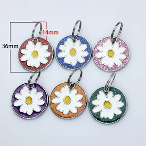 Detailed view of six colorful glitter daisy pet tags with 36mm height dimension marker