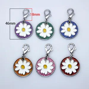 Detailed dimension view of colorful glitter daisy pet ID tags with lobster clasps