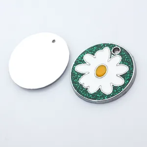 Detailed view of green glitter pet ID tag with white daisy and plain silver back