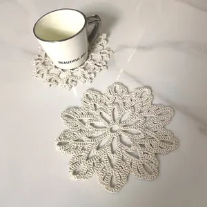 Detailed view of handmade crochet cotton coaster with vintage snowflake lace pattern