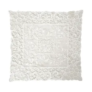 Macro detail of exquisite white lace floral embroidery on transparent mesh decorative cloth