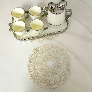 Runde Retro-Tischmatte aus hohlbestickter Spitze für Dekoration und Produktfotografie