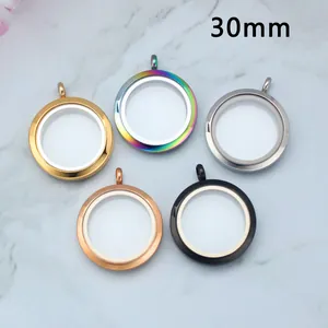 30mm stainless steel glass locket pendants in five finishes on marble background