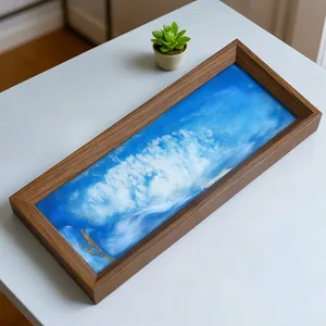 Detalle de arte de arena movediza 3D azul en un marco de madera rectangular nogal