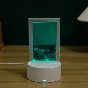 Luz nocturna de arte de arena movediza verde en base
