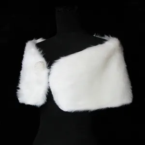 Detailed view of the soft white faux fur shawl featuring an elegant pearl ball clasp