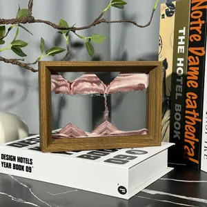 Detail of 3D moving sand art in a wooden frame for home office decor