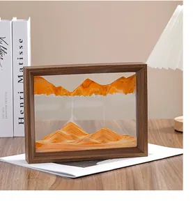 Cuadro de arte de arena en movimiento con paisajes naranjas en un marco de madera rústico